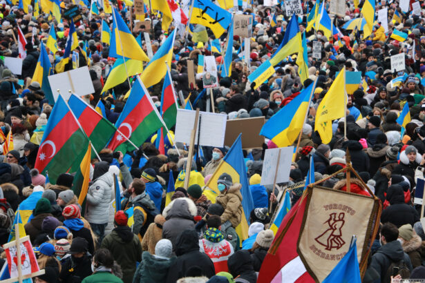 Members of the Azerbaijani community show solidarity with Ukraine during the "Mega March for Ukraine" in downtown Toronto on February 27, 2022.